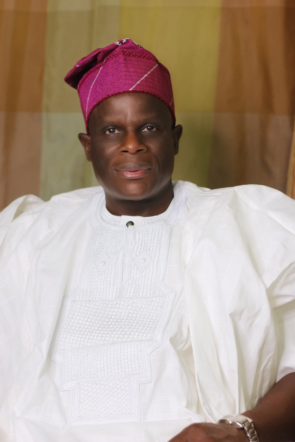 Olu Akanmu in white traditional attire